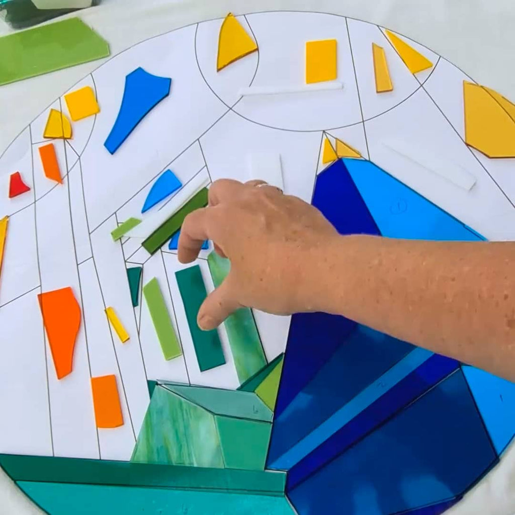 Cutting blue, teal and green art glass