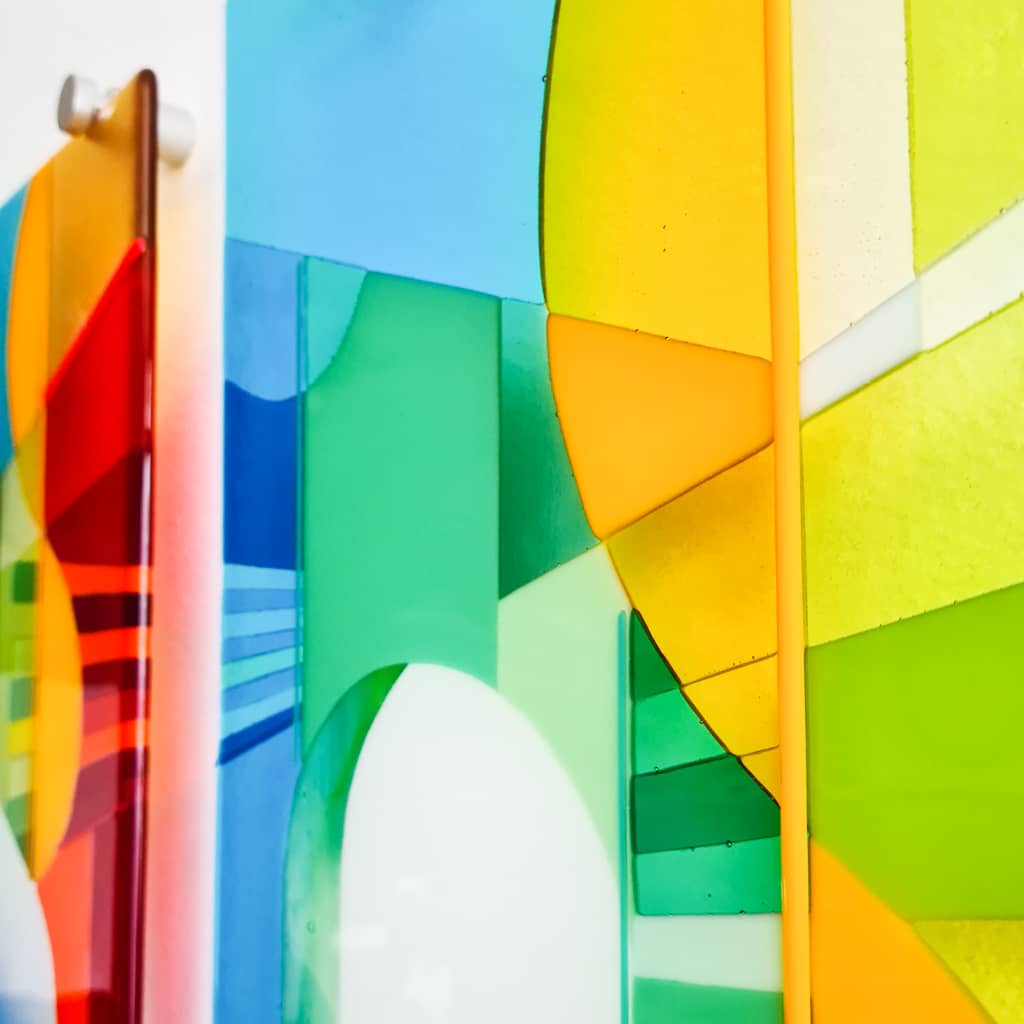 Modern art glass panels designed to be secured to the wall