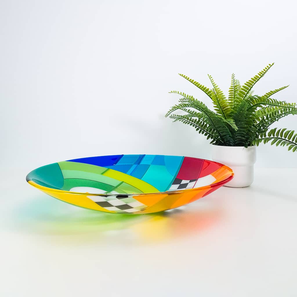 Fused glass art dish in rainbow colours in a Hard Edge glass art style