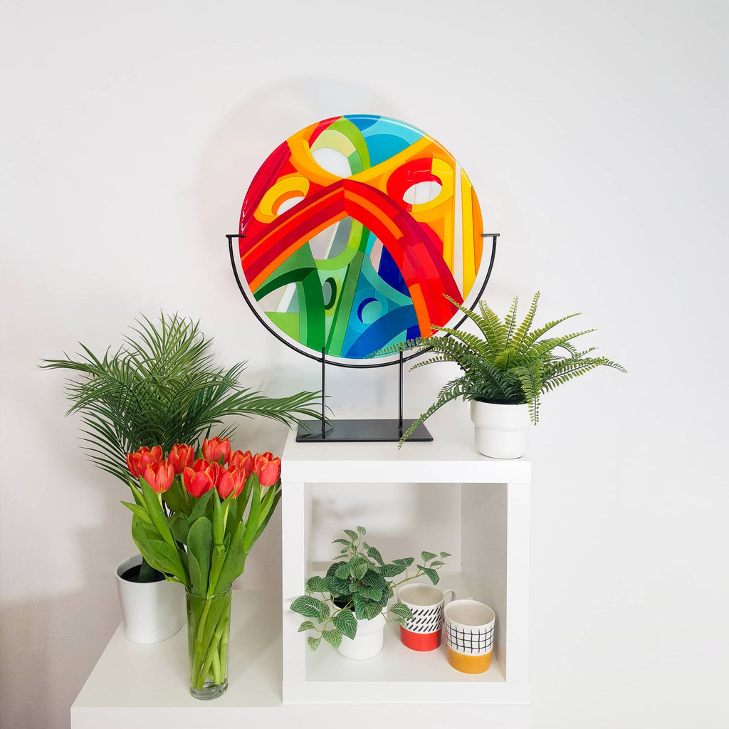Unique glass roundel in rainbow colours in a Hard Edge glass art style
