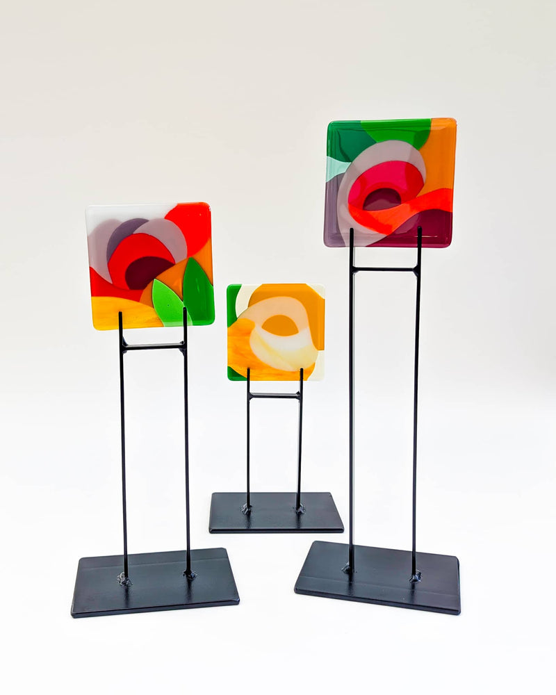 Set of commissioned Floral glass Miniatures displayed on custom metal stands