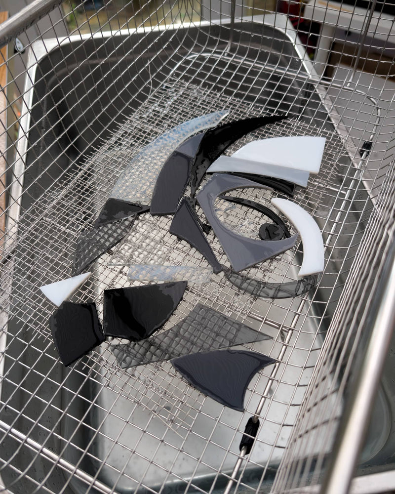 Work in progress on a commissioned contemporary glass Miniature showing individually cut glass pieces before assembly and firing