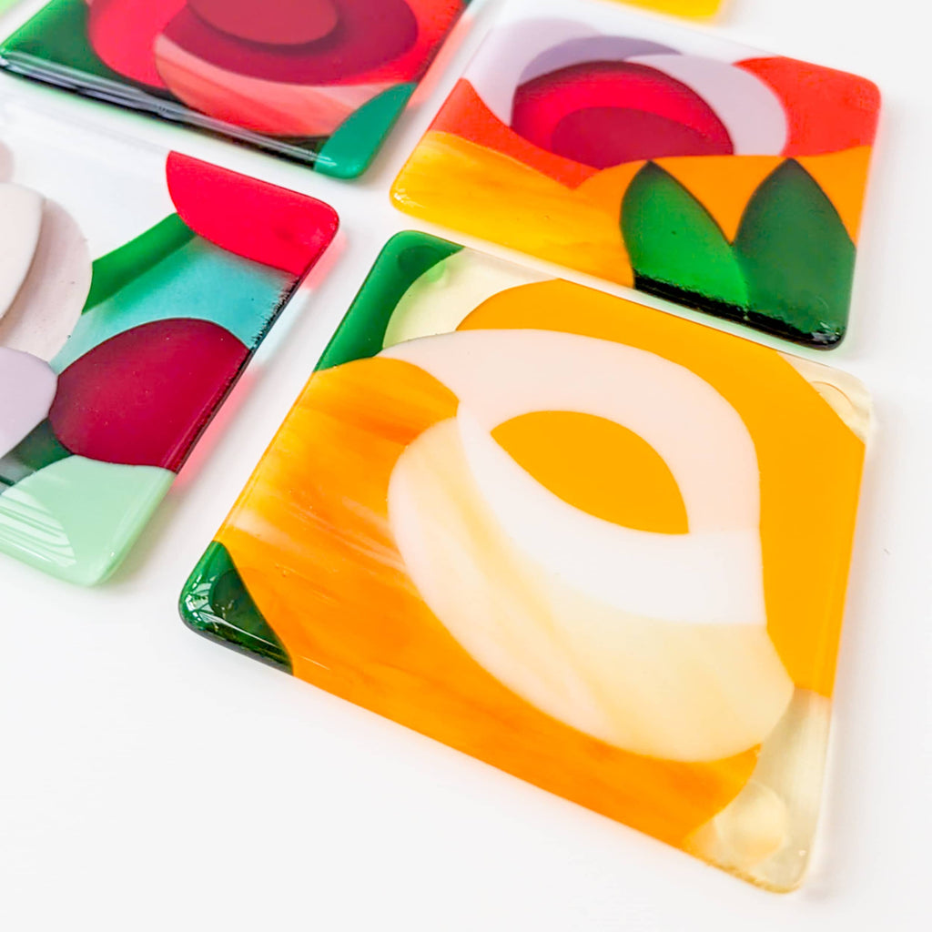 A set of 4 fused art glass Miniatures in a floral theme