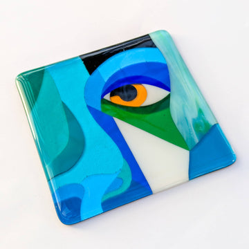 Colorful abstract art piece with eye design on a white background