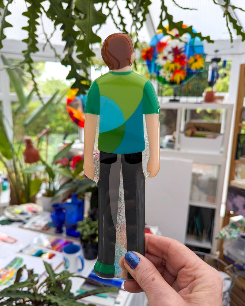 Close-up of one commissioned contemporary glass Miniature by Linda Rossiter showing the finished grandson figure
