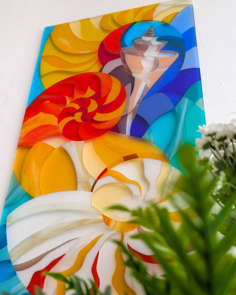 'The Sea' fused glass art wall panel showing three shells, part of a diptych with 'Gardening'