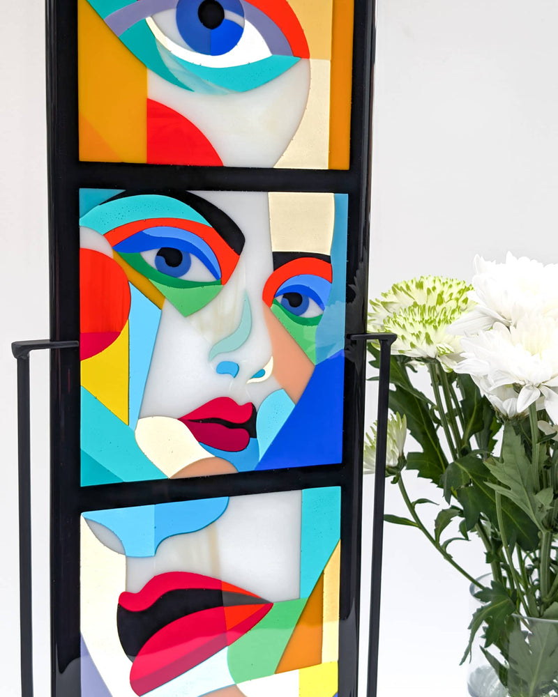 Close-up of 'Alluring Montage' commissioned contemporary Hard Edge glass artwork showing the geometric portrait composition created from individually cut glass pieces