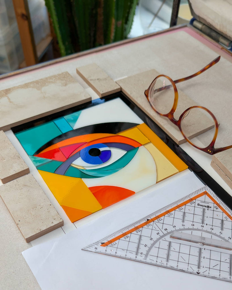 Work in progress creating 'Alluring Montage', a commissioned contemporary Hard Edge glass artwork with individually cut glass pieces precisely assembled before kiln firing