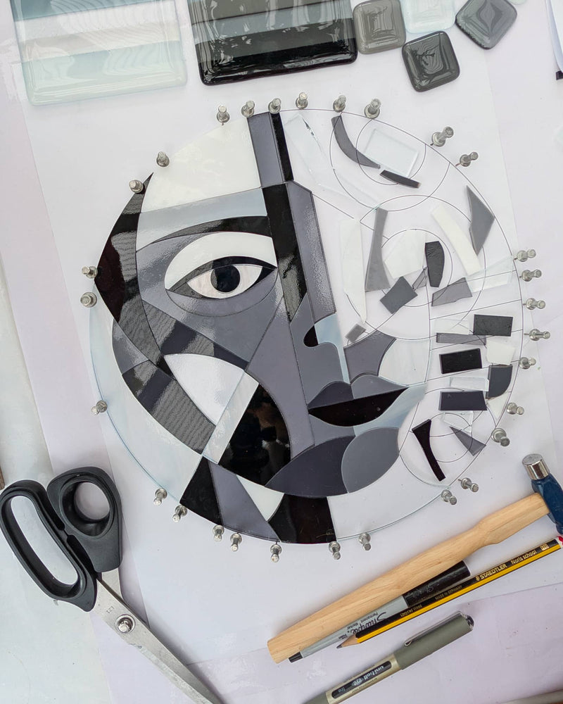 Work in progress creating 'Mono Lisa', a commissioned contemporary Hard Edge glass artwork with individually cut glass pieces precisely fitted together before kiln firing