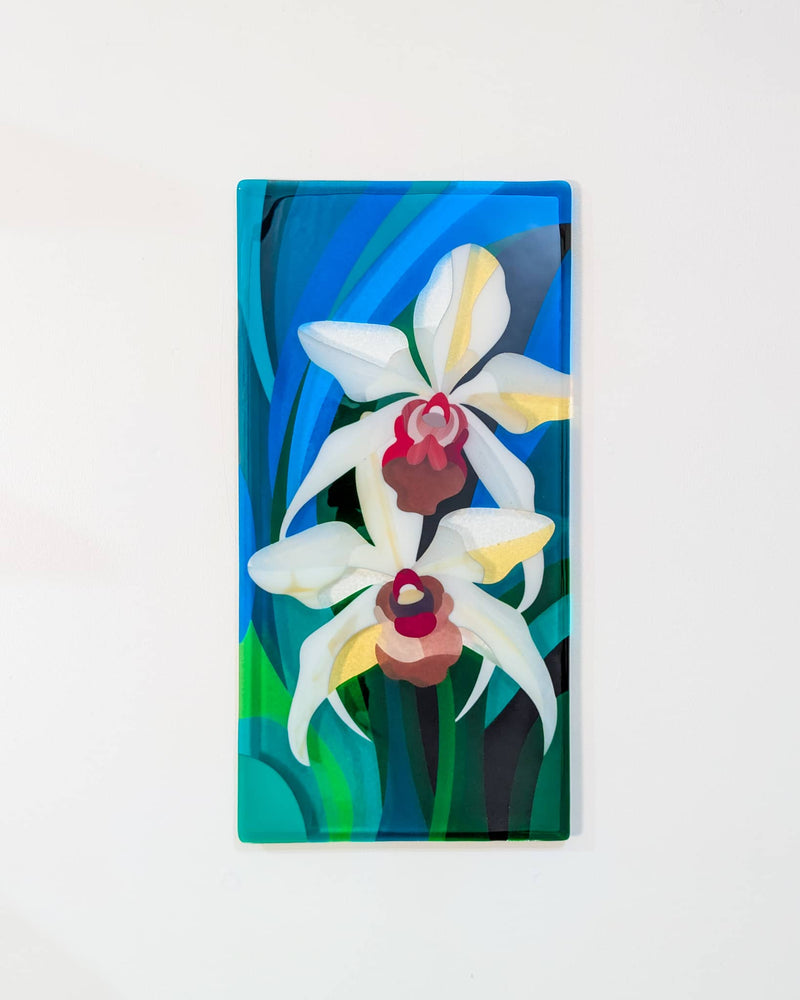 Orchids contemporary fused glass wall panel with two large white flowers against a blue, turquoise and green background