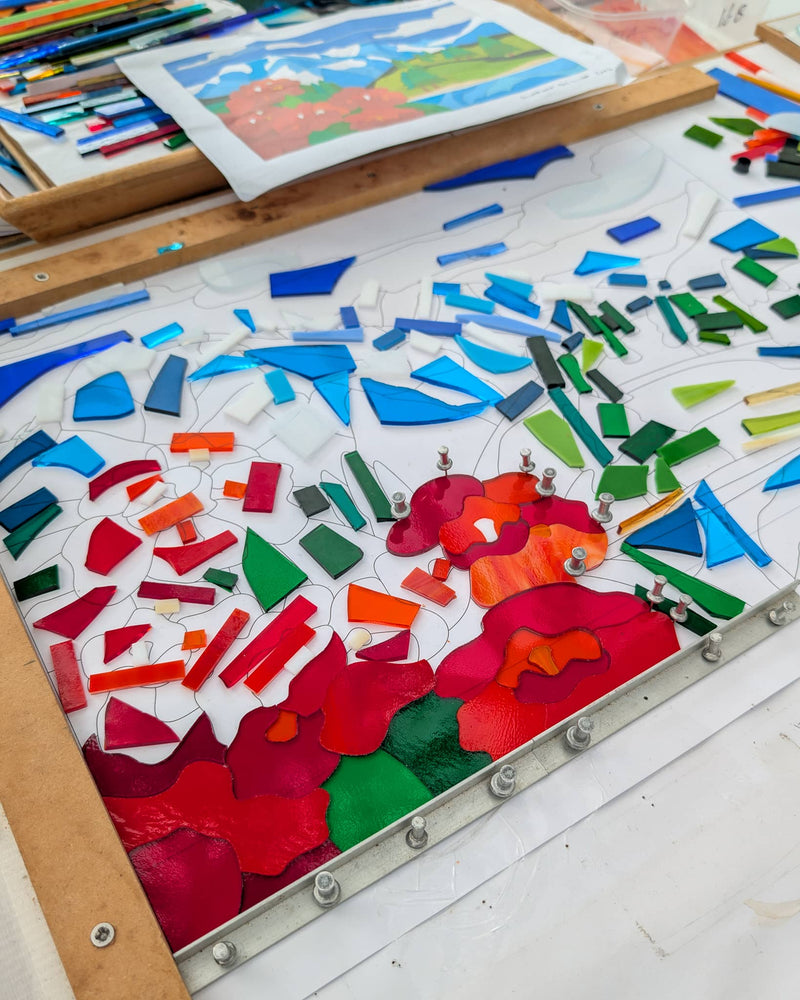 Work in progress creating 'Shangri-La', a commissioned contemporary Hard Edge glass artwork with individually cut glass pieces precisely fitted together before kiln firing