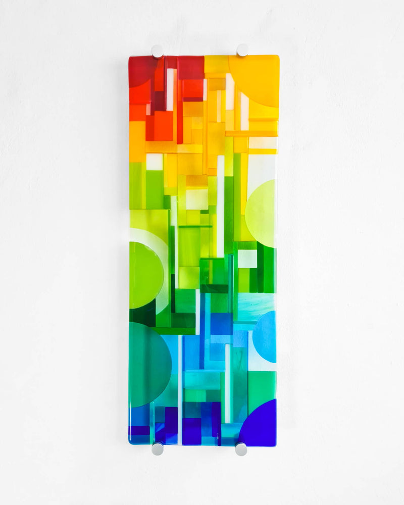 Spectrum abstract fused glass wall panel with bands of red, yellow, green, turquoise and blue