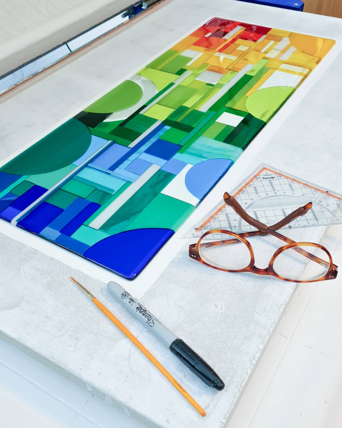 'Spectrum' contemporary Hard Edge glass wall artwork in the kiln after fusing