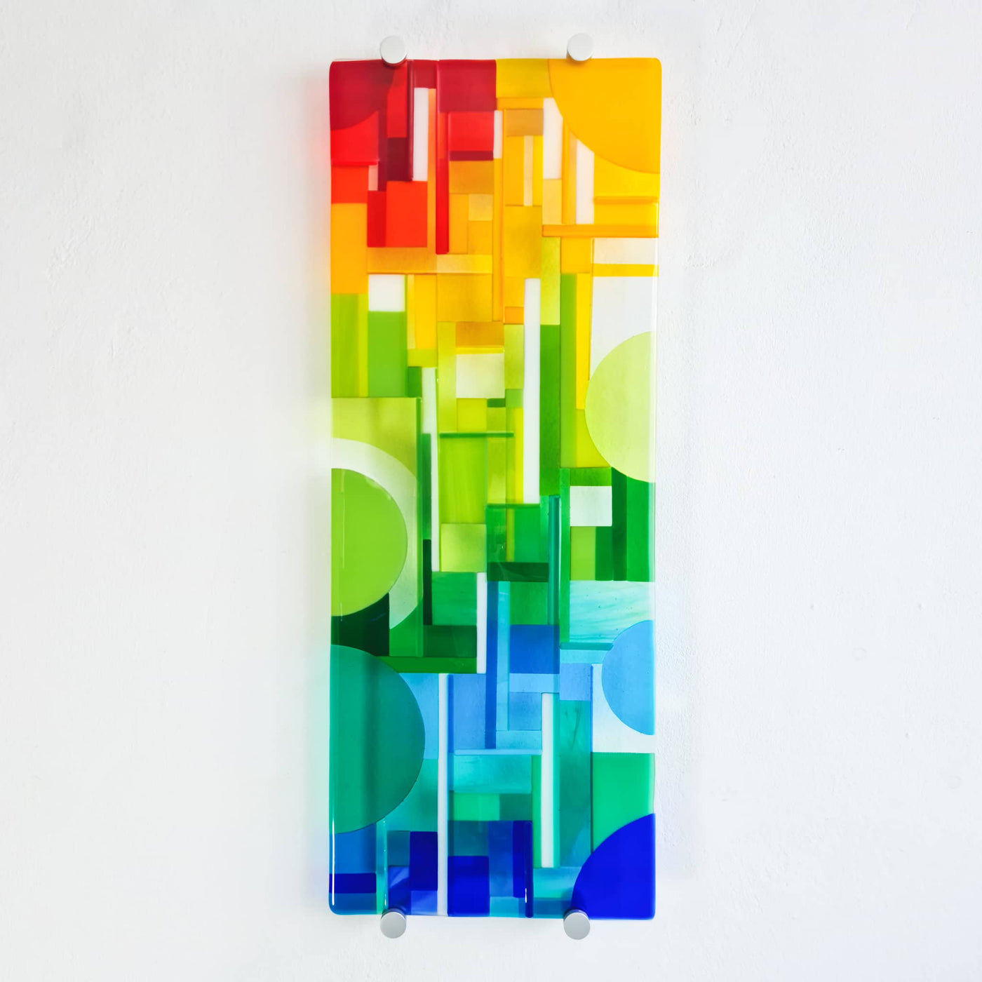'Spectrum' contemporary Hard Edge fused glass wall artwork by Linda Rossiter, featuring an abstract composition inspired by the coloured glass bars in her workshop