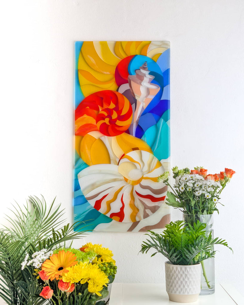 The Sea contemporary fused glass wall panel with large shells and conches in orange, yellow, cream, blue and turquoise