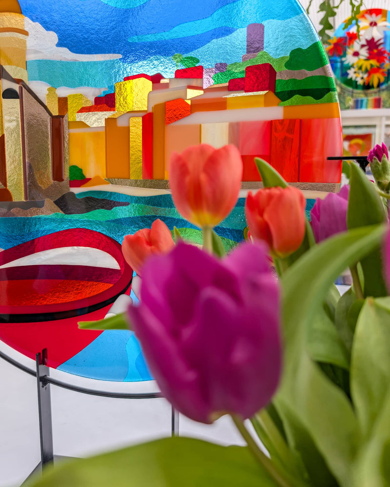Close-up of the commissioned Vernazza Hard Edge glass artwork showing colourful buildings, sea and boats created from individually cut glass pieces
