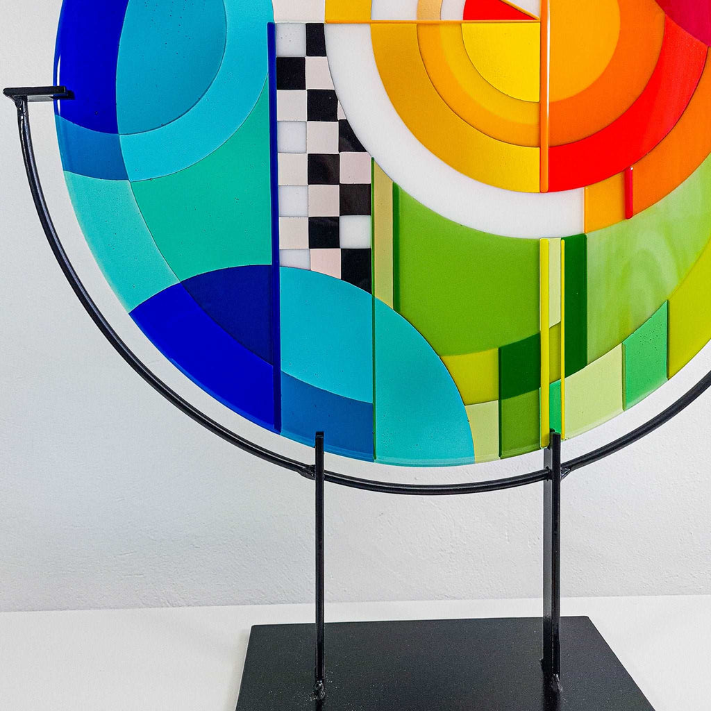 Chequer large round fused glass art. Fused glass artwork in rainbow colours in a Hard Edge glass art style