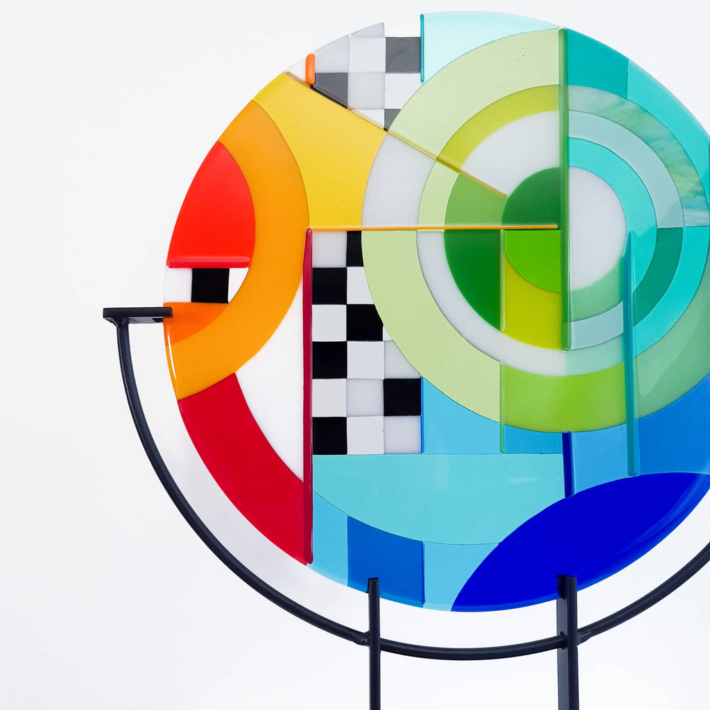 Chequer round fused glass art sculpture by Glass Art by Linda. Fused glass roundel in rainbow colours in a Hard Edge glass art style