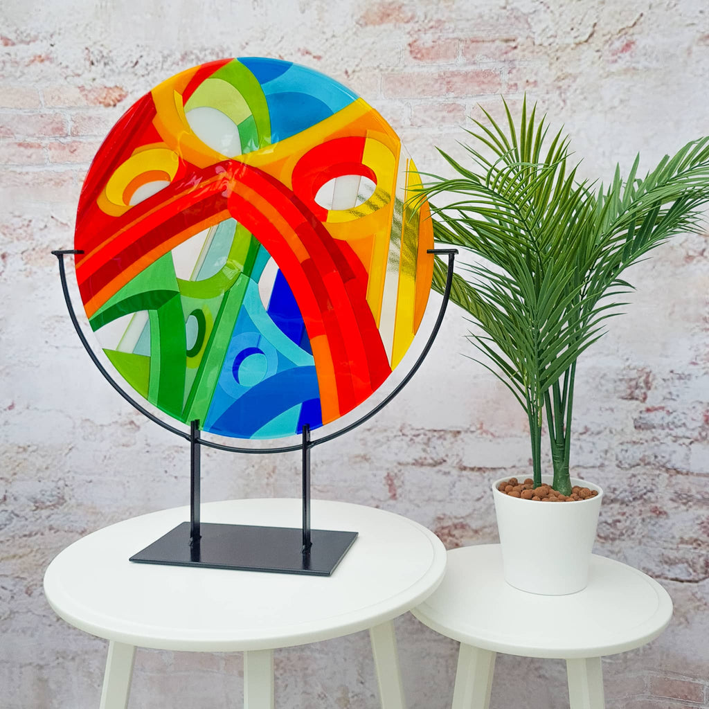 Wells large round fused glass art sculpture by Glass Art by Linda. Unique glass roundel in rainbow colours in a Hard Edge glass art style